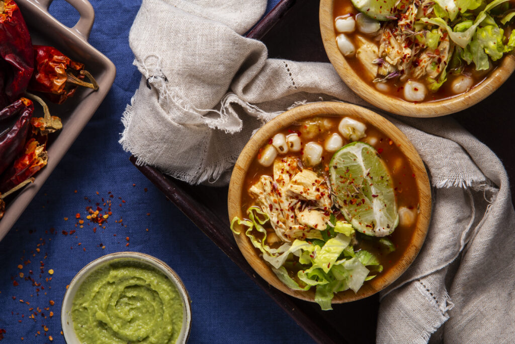 Colorful assortment of authentic Mexican dishes, including tacos and mole