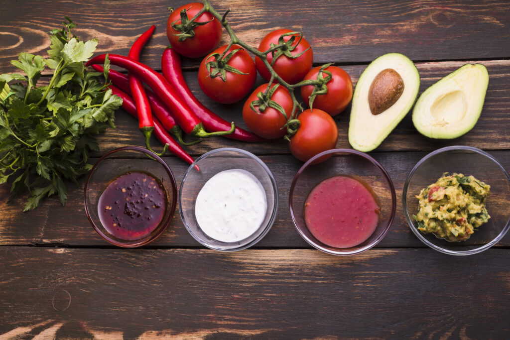 fresh ingredients and kitchen tools for making homemade Mexican salsas